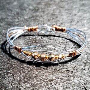 ** SOLD**. Elegant Silver and Gold Tone Wire Bracelet